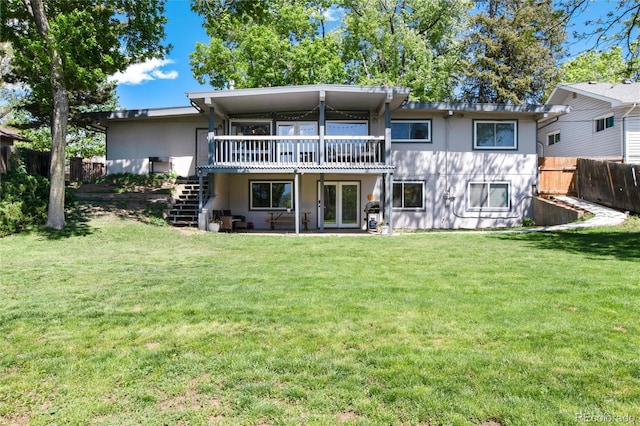 4545 S Lipan Ct, Englewood, CO 80110 - back of property featuring stairway, a deck, and stucco siding