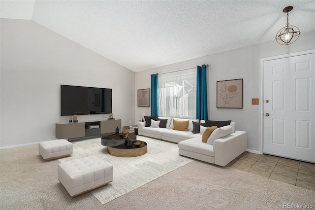 living room featuring a textured ceiling, light carpet, and lofted ceiling