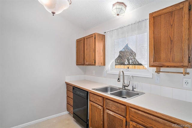 kitchen featuring a textured ceiling, black dishwasher, lofted ceiling, and sink