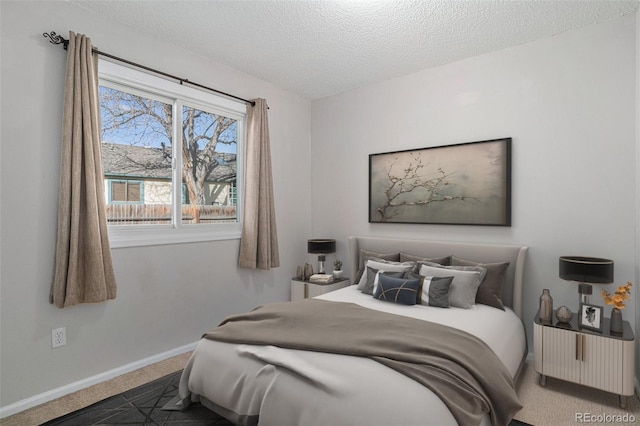 bedroom with carpet flooring and a textured ceiling