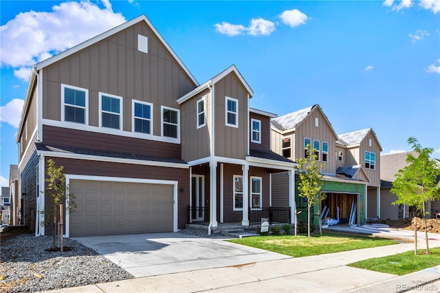 5626 W 142nd Ave, Broomfield, CO 80020 - view of front facade featuring an attached garage, driveway, covered porch, board and batten siding, and a residential view