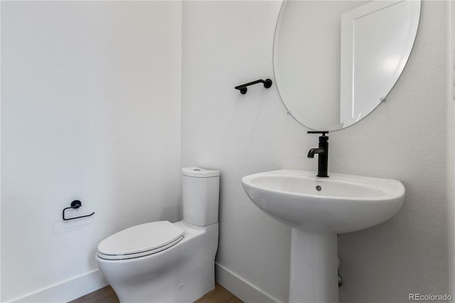 5626 W 142nd Ave, Broomfield, CO 80020 - bathroom featuring toilet and wood finished floors