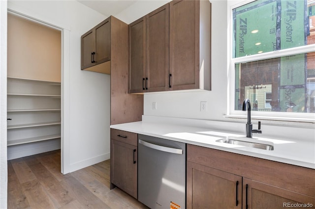 5626 W 142nd Ave, Broomfield, CO 80020 - kitchen featuring dishwasher, light wood-style floors, and light countertops