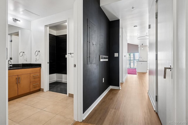 891 14th St Unit 2105, Denver, CO 80202 - corridor featuring a sink and light wood-style floors