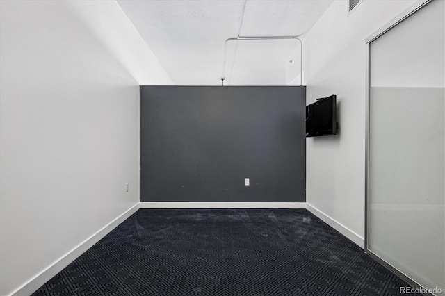 891 14th St Unit 2105, Denver, CO 80202 - additional living space featuring dark carpet and baseboards