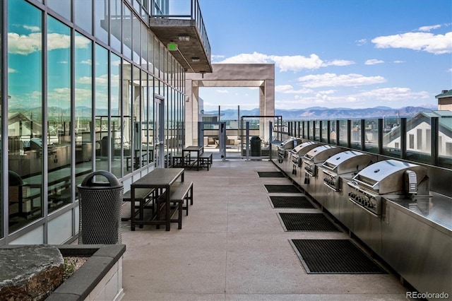 891 14th St Unit 2105, Denver, CO 80202 - view of patio / terrace with a mountain view and exterior kitchen