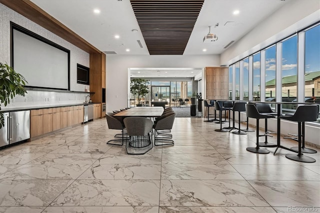 891 14th St Unit 2105, Denver, CO 80202 - dining room featuring light marble finish flooring and recessed lighting