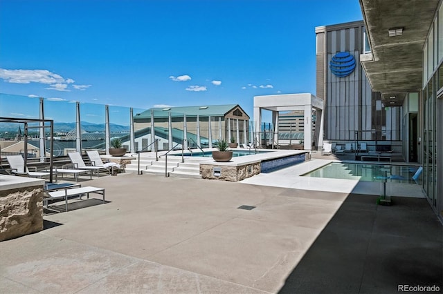 891 14th St Unit 2105, Denver, CO 80202 - community pool featuring a mountain view, a patio, and stairway