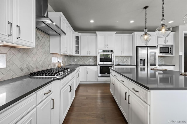 11522 Trona Ct, Parker, CO 80138 - kitchen with stainless steel appliances, wall chimney exhaust hood, dark countertops, recessed lighting, and white cabinets