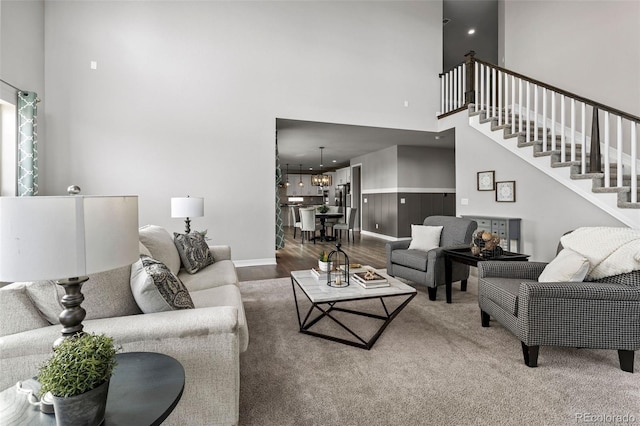 11522 Trona Ct, Parker, CO 80138 - living area with a high ceiling, wood finished floors, stairway, and baseboards