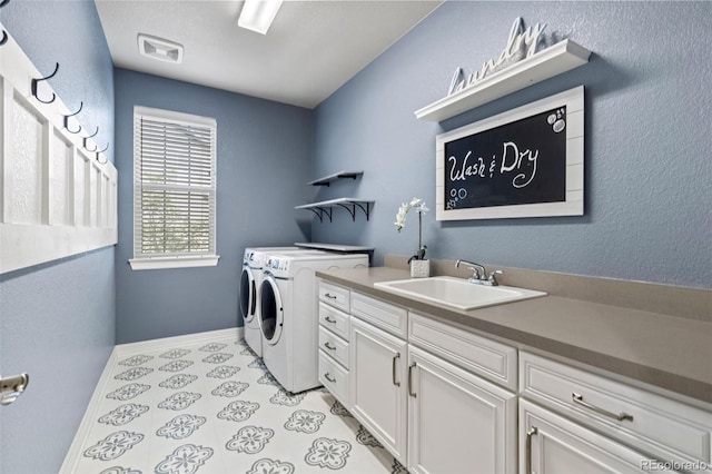 11522 Trona Ct, Parker, CO 80138 - laundry area with washer and dryer, cabinet space, and baseboards