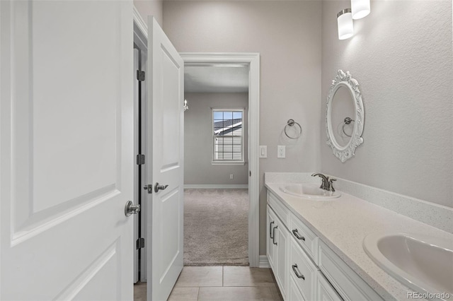 11522 Trona Ct, Parker, CO 80138 - bathroom featuring double vanity, baseboards, and tile patterned flooring