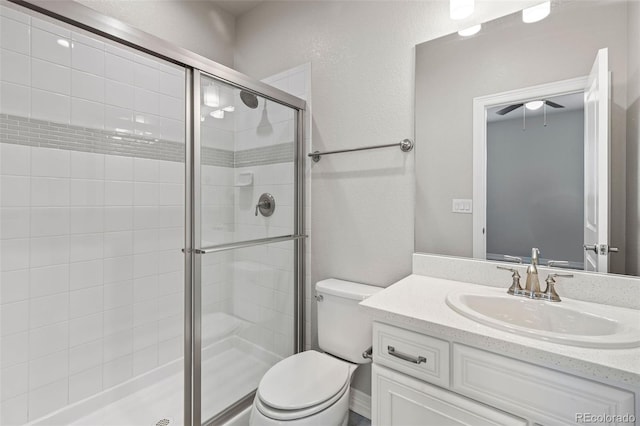 11522 Trona Ct, Parker, CO 80138 - full bath with a shower stall, vanity, toilet, and a ceiling fan