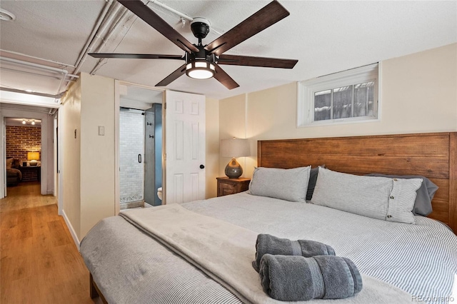 bedroom featuring wood finished floors and ceiling fan