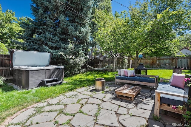 view of patio with a hot tub and outdoor lounge area