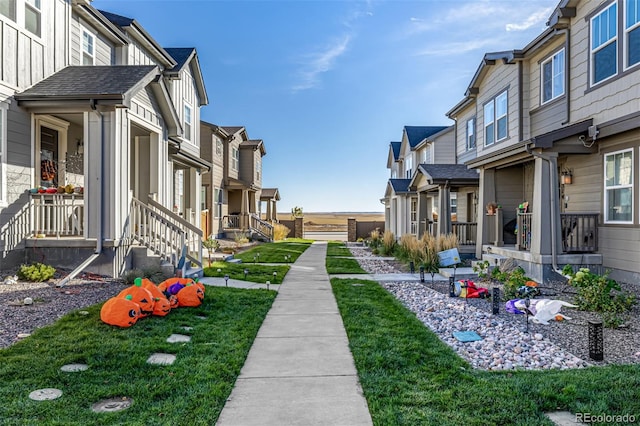 view of property's community featuring a lawn