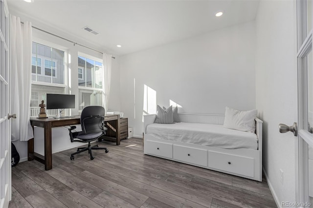 bedroom featuring hardwood / wood-style floors