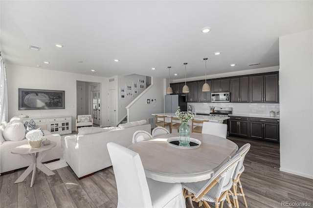 dining space with dark wood-type flooring