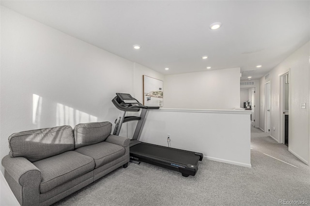 exercise room with light carpet