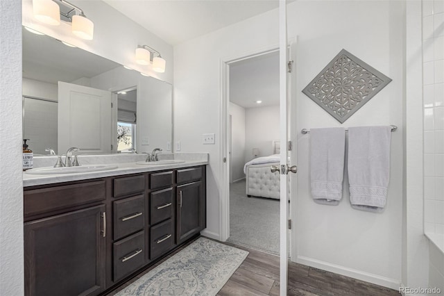 bathroom with vanity and hardwood / wood-style flooring