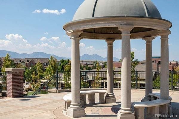 view of patio featuring a gazebo and a mountain view