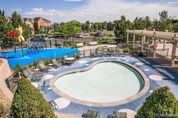 view of pool with fence, a pergola, and a patio