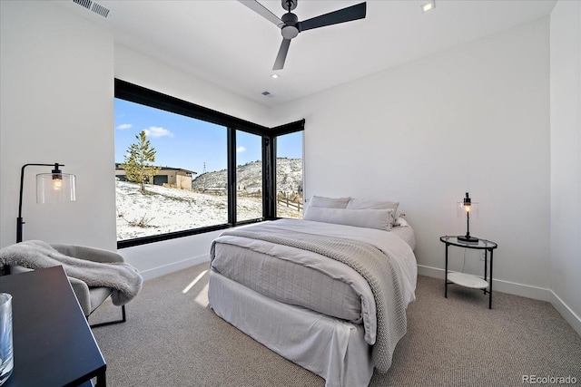 bedroom featuring carpet floors, visible vents, ceiling fan, and baseboards