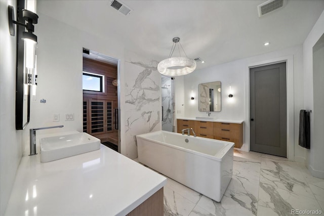 full bath with marble finish floor, visible vents, and a sink