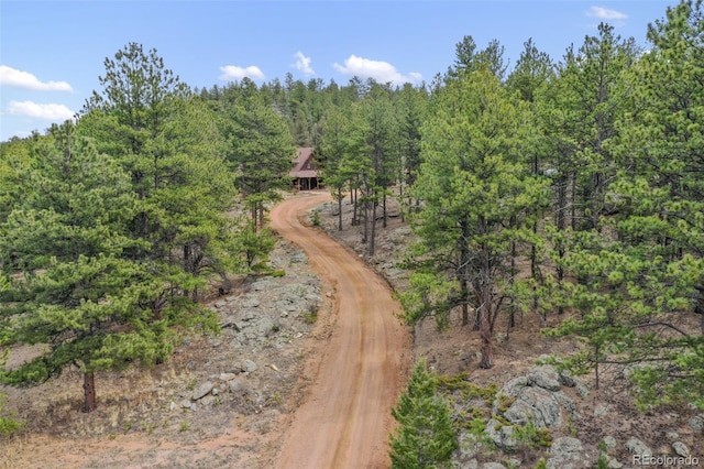 exterior space with a wooded view