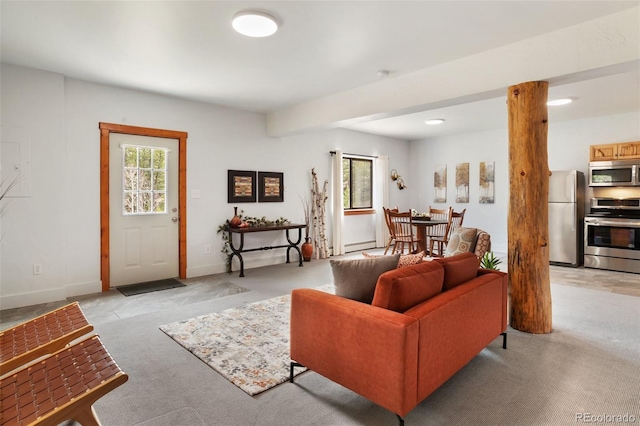 living room featuring baseboards and light carpet