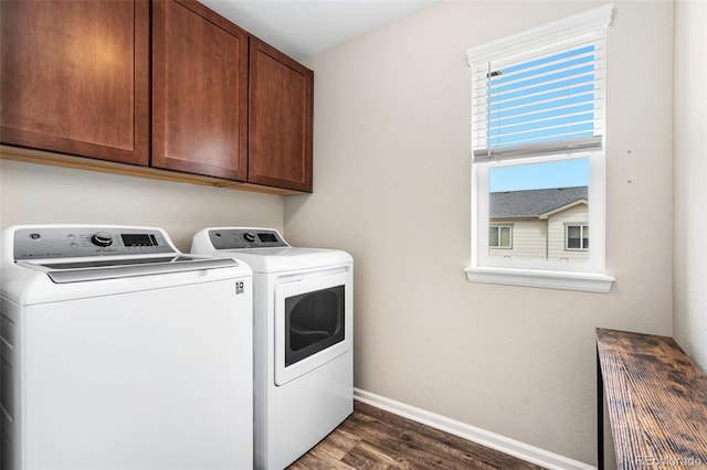 18077 E 99th Ave, Commerce City, CO 80022 - laundry area featuring washer and clothes dryer, dark wood-type flooring, baseboards, and cabinet space