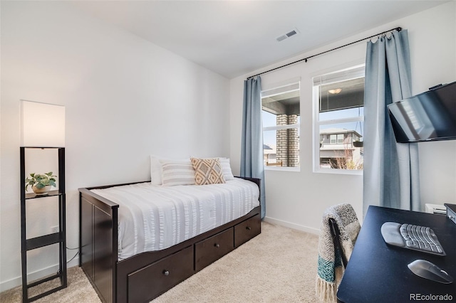 8517 Eckley St, Littleton, CO 80125 - carpeted bedroom featuring a desk and baseboards