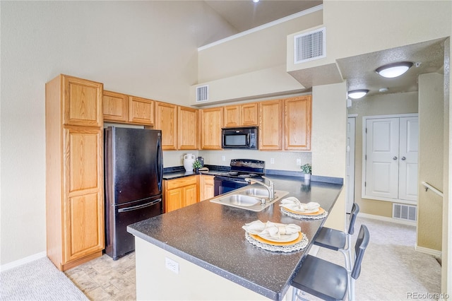 kitchen featuring black appliances, high vaulted ceiling, dark countertops, a peninsula, and baseboards