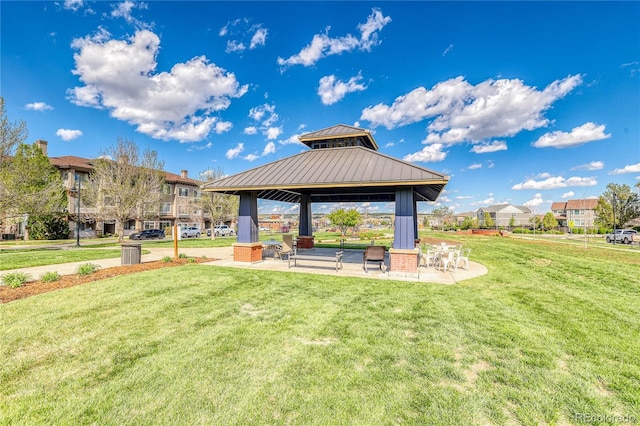 surrounding community with a gazebo, a lawn, and a patio area