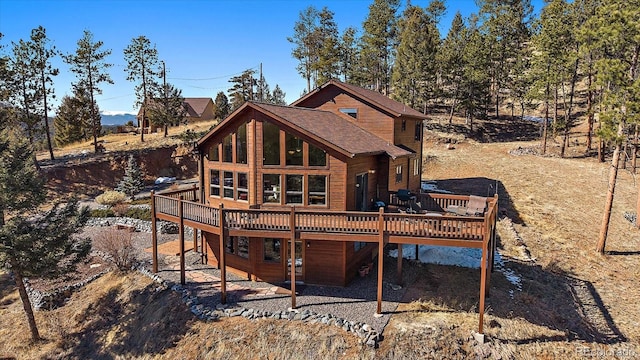 rear view of property with a deck