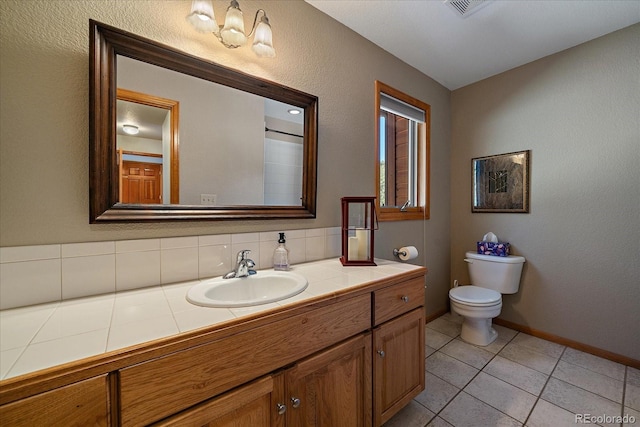 bathroom featuring visible vents, baseboards, toilet, tile patterned flooring, and vanity