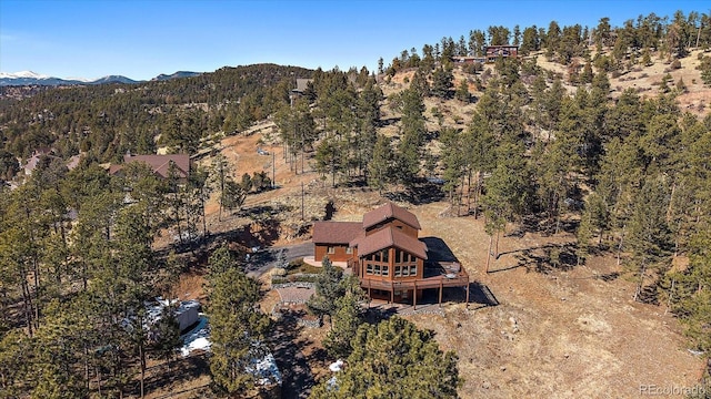 bird's eye view featuring a mountain view and a forest view