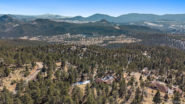 bird's eye view featuring a mountain view and a view of trees