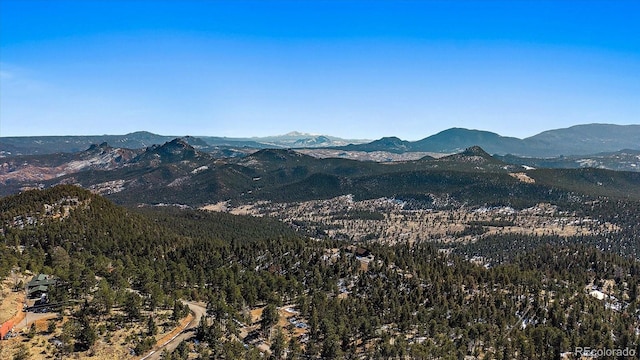 mountain view featuring a forest view