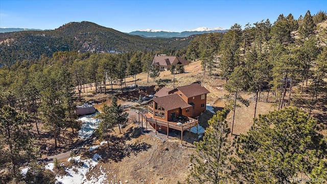 aerial view featuring a mountain view and a forest view