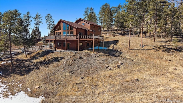 rear view of house with a deck