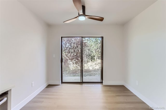 spare room featuring ceiling fan and light hardwood / wood-style floors