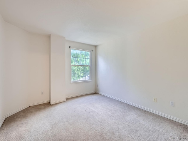 5155 W Quincy Ave Unit J103, Denver, CO 80236 - spare room with carpet flooring and baseboards