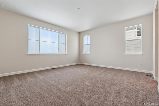 view of carpeted spare room