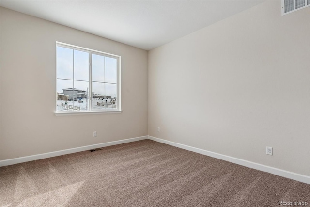 unfurnished room with carpet flooring