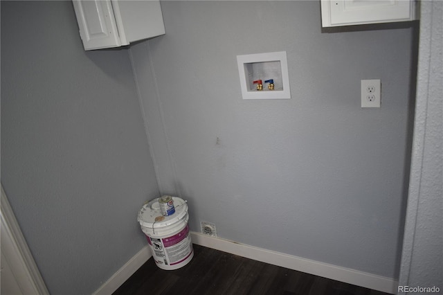 laundry room with dark wood-style flooring, hookup for a washing machine, baseboards, electric dryer hookup, and cabinet space