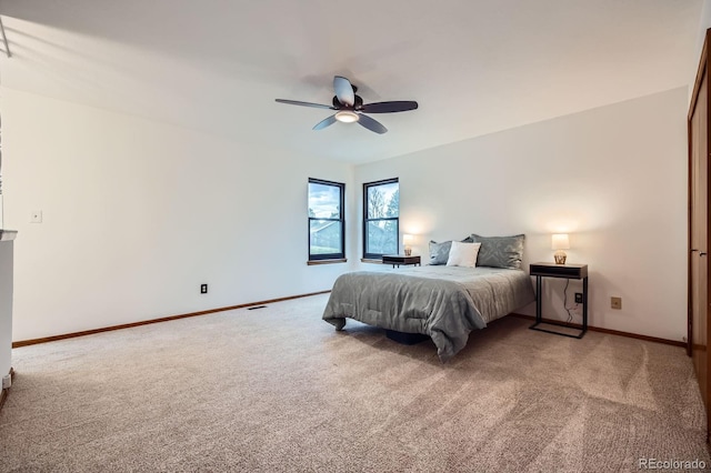 6545 Grey Eagle Ln, Colorado Springs, CO 80919 - bedroom with baseboards, a ceiling fan, and light carpet