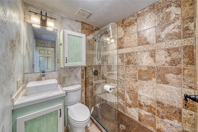 6375 Terrace Ln, Salida, CO 81201 - bathroom with a walk in shower, vanity, and a textured ceiling