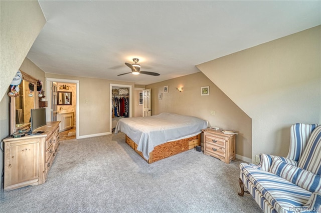6375 Terrace Ln, Salida, CO 81201 - bedroom with light carpet, a walk in closet, a closet, and ceiling fan