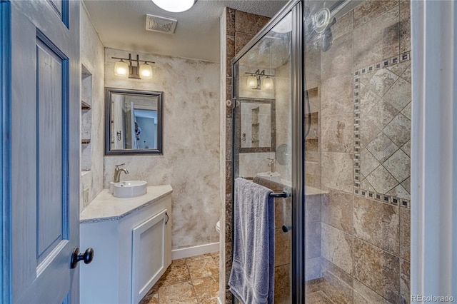 6375 Terrace Ln, Salida, CO 81201 - bathroom featuring vanity, a shower stall, and a textured ceiling